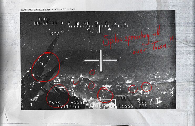 带有红色批注的空中监视画面。
